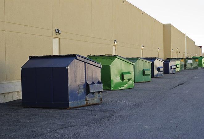 red and green waste bins at a building project in East Meadow, NY